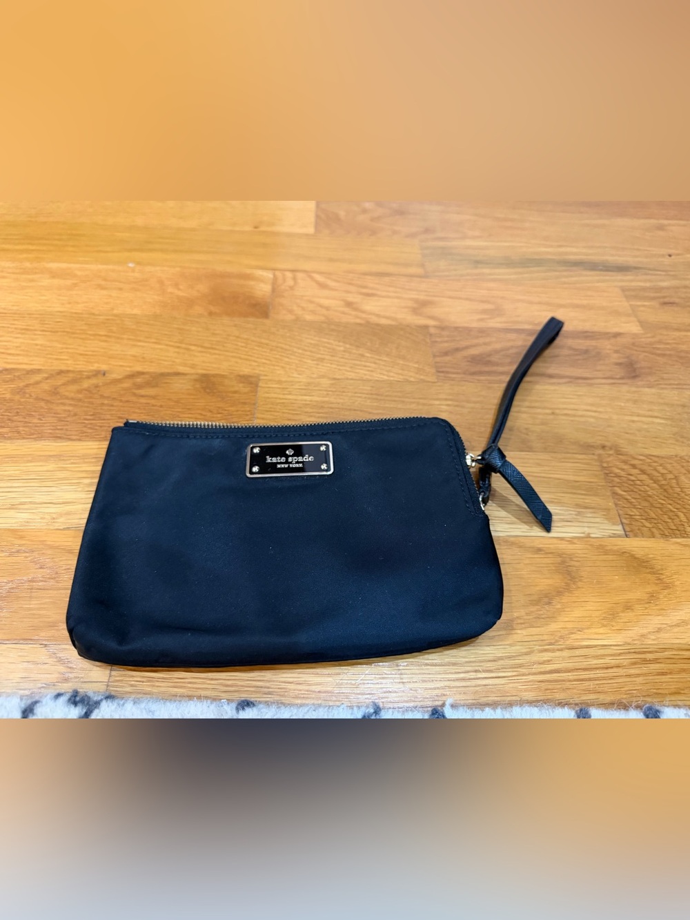 kate spade Black Nylon Wristlet with Gold Logo Plate